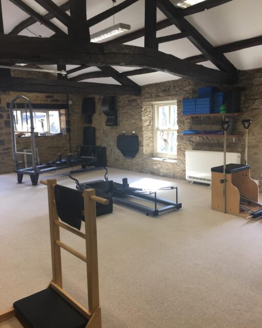 We often get asked if we do reformer classes. 
Yes we have two reformers, but no we don’t run reformer classes exclusively. 
As a Comprehensive Pilates Instructor, I teach the entire Pilates system - not just reformer classes - because Joseph Pilates designed his method as an interconnected, full-body approach using a variety of apparatus, each serving a unique purpose within the system.
The full Pilates system includes the Reformer, Cadillac, Wunda Chair, Ladder Barrel, Spine Corrector, Mat, and several smaller pieces of equipment. Each apparatus is designed to complement the others, helping the body find balance, strength, and control through a progressive and intelligently structured method. By working with the full range of equipment, I can tailor sessions precisely to each individual’s needs - whether that means supporting, challenging, or refining their movement in a way that a one-size-fits-all reformer class simply cannot.
While reformer classes can offer a great workout, they tend to be more generalised. Everyone in the room performs the same sequences, often at a similar pace, using the same springs and setup. The focus is typically on fitness rather than the therapeutic and corrective power of Pilates as a complete system.
In contrast, teaching the full system allows for a far more holistic and personalised experience. I can choose the right apparatus for each client’s body and goals on any given day - using the Cadillac to build stability, the Chair to develop power and balance, or the Barrels to restore alignment and flexibility. This way, the work meets the body where it is, rather than forcing the body to fit the work.
Ultimately, teaching the full Pilates system honours the original intention of Joseph Pilates - a complete method of movement that integrates mind, body, and spirit, and restores natural strength and vitality through precision and progression. It’s not just a class - it’s a whole-body education in movement.